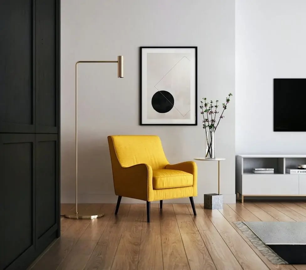 Mustard yellow accent Armchair and Modern Floor Lamp on Wooden Parquet Flooring